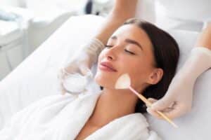 Woman relaxing as she receives chemical peel treatment in Alexandria, VA